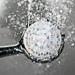 Black shower head switched on